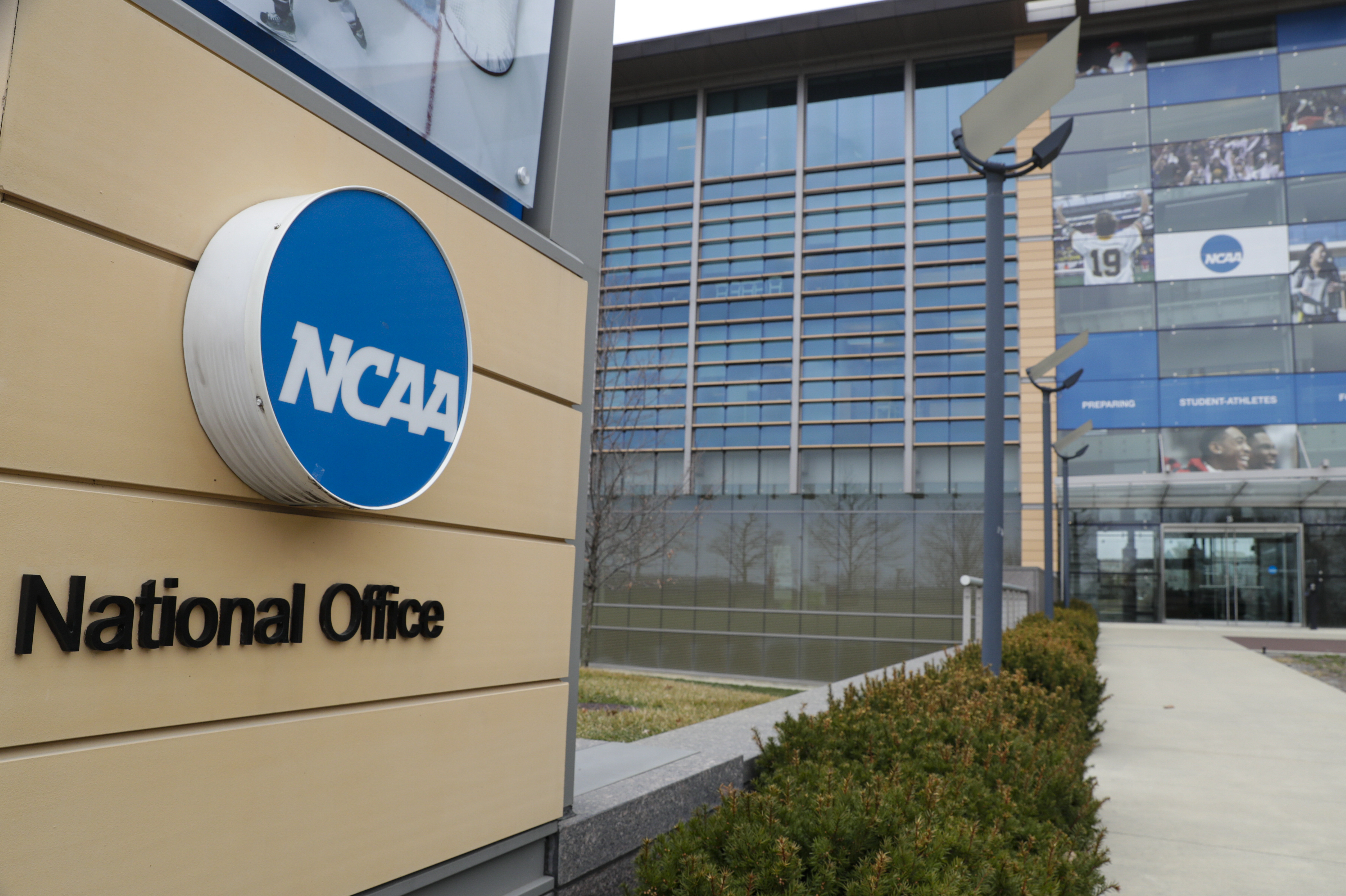 FILE - NCAA headquarters in Indianapolis is shown March 12, 2020. The NCAA and a coalition of states suing the organization announced a proposed settlement of a lawsuit Thursday, May 30, 2024, that would allow athletes to be immediately eligible to play no matter how many times they transfer and offer them an extra year of eligibility. 