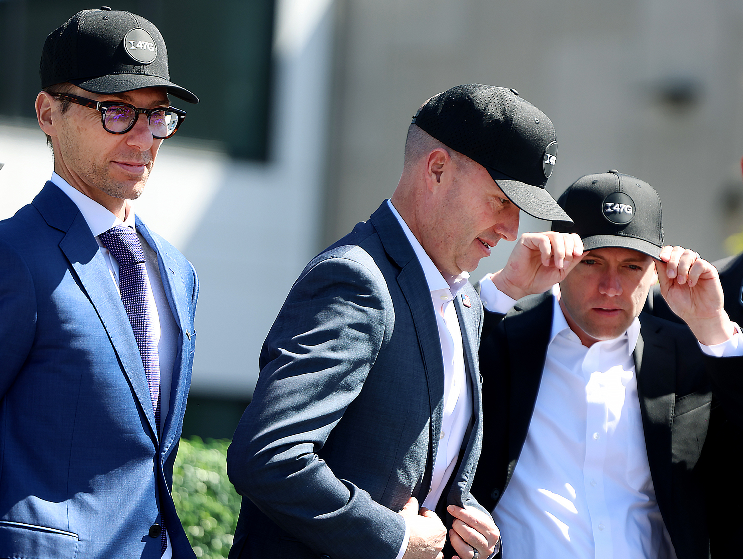 Philippe Chevrier, Hexcel President, Gov. Spencer Cox and Aaron Starks, 47G president and CEO, don 47G caps for a photo during the launch of Project Alta at Hexcel Corporation in West Valley City on Thursday.