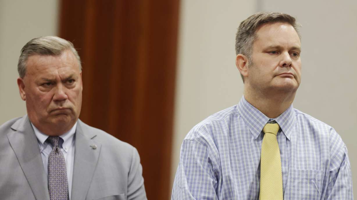 Chad Daybell, right, stands with defense attorney John Prior as the jury's verdict in his murder trial is read on Thursday. Daybell was convicted of killing his wife and his new wife's two youngest kids.