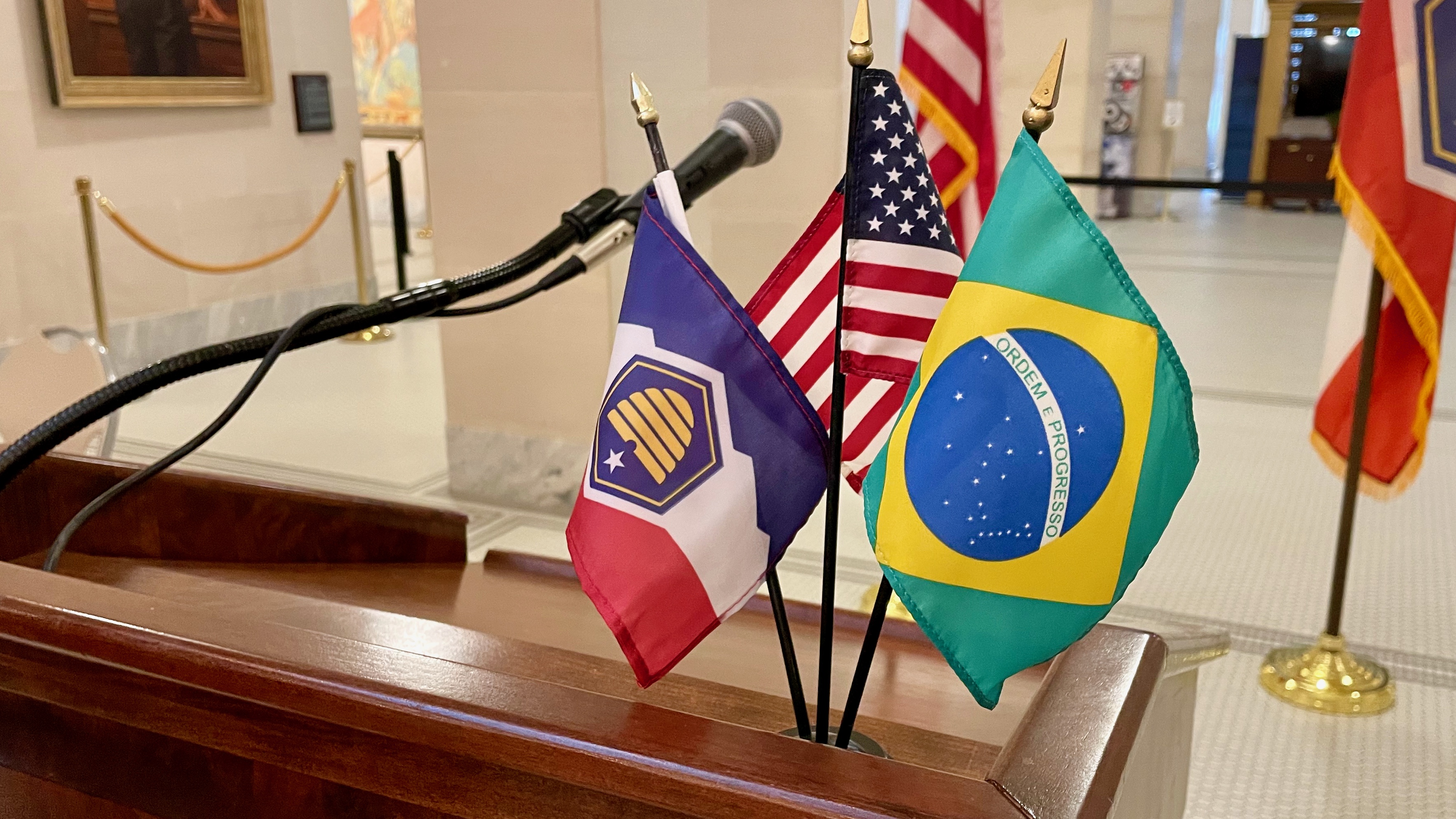 Brazilian, U.S. and Utah flags on the podium at a gathering on Thursday at the Utah Capitol in Salt Lake City to mark the revival of the Brazilian American Chamber of Commerce of Utah.
