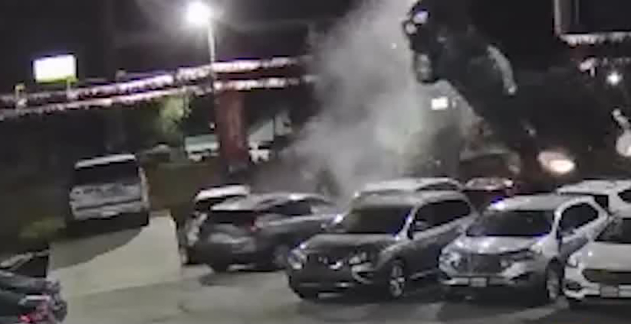 Surveillance footage shows an SUV going south on State Street near 1720 North in Provo at a high rate of speed Thursday, hitting the curb and launching off two cars on the corner of a car dealership lot.