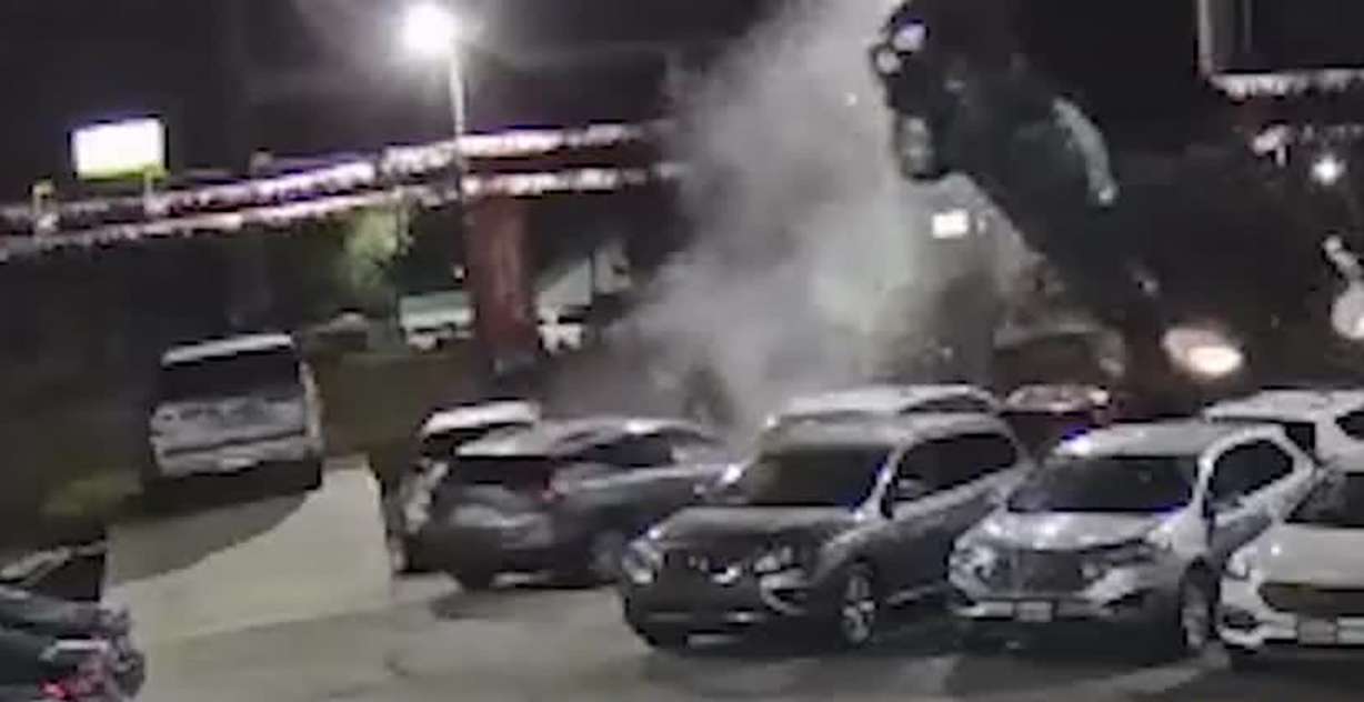 Surveillance footage shows an SUV going south on State Street near 1720 North in Provo at a high rate of speed Thursday, hitting the curb and launching off two cars on the corner of a car dealership lot.