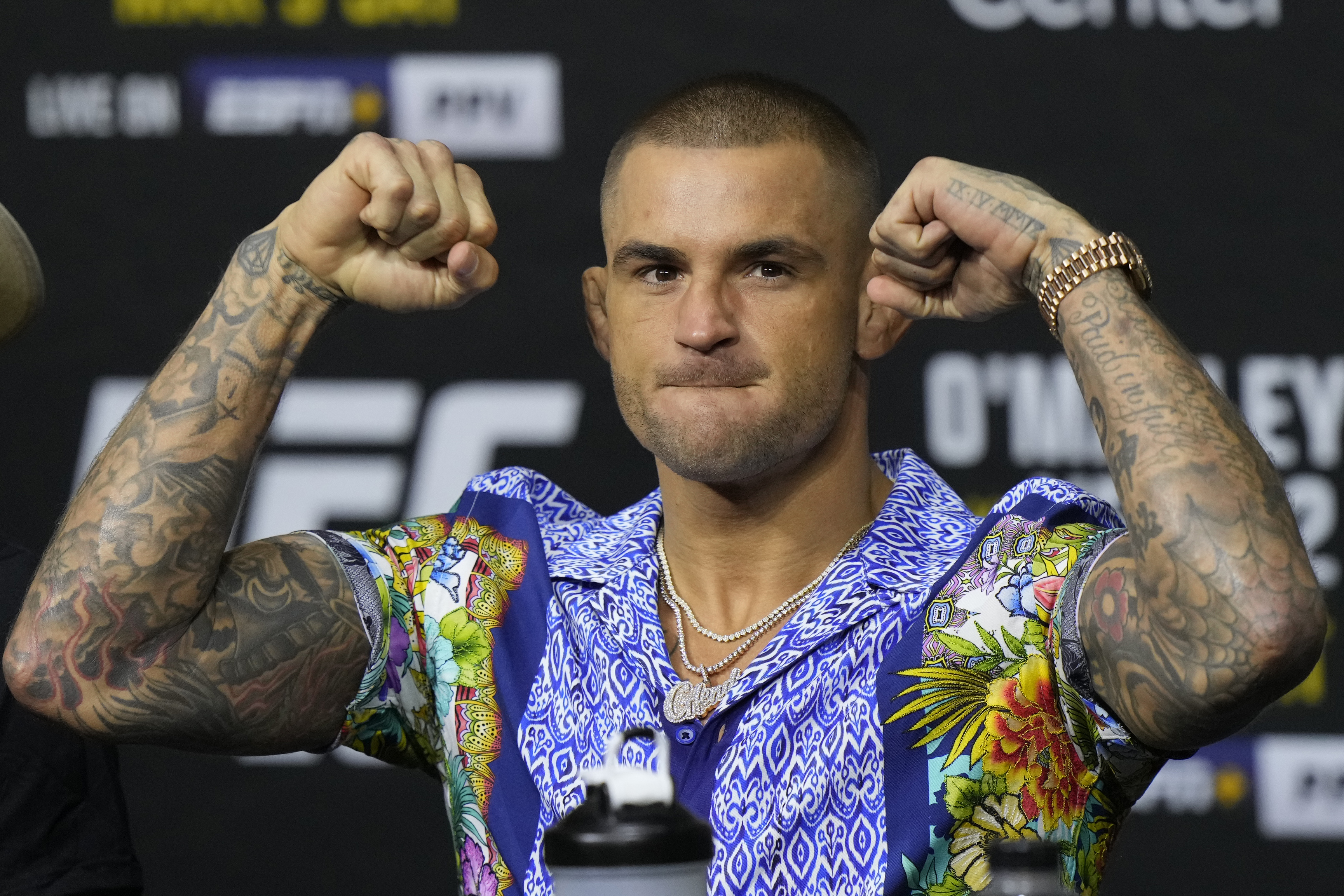 FILE - Dustin Poirier poses during a news conference UFC 299 mixed martial arts event, Thursday, March 7, 2024, in Miami. Poirier has won 30 MMA fights overall and has at least one more left - a career-defining bout on a third try at the UFC lightweight championship - against Islam Makhachev in the main event of UFC 302 on Saturday in New Jersey.