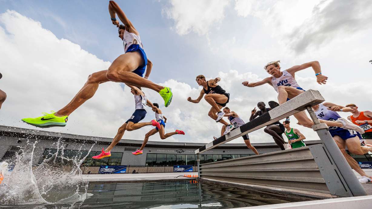 BYU's James Corrigan leaps over the water pit during the 3,000-meter steeplechase at the NCAA West preliminaries in Fayetteville, Arkansas, May 24, 2024.