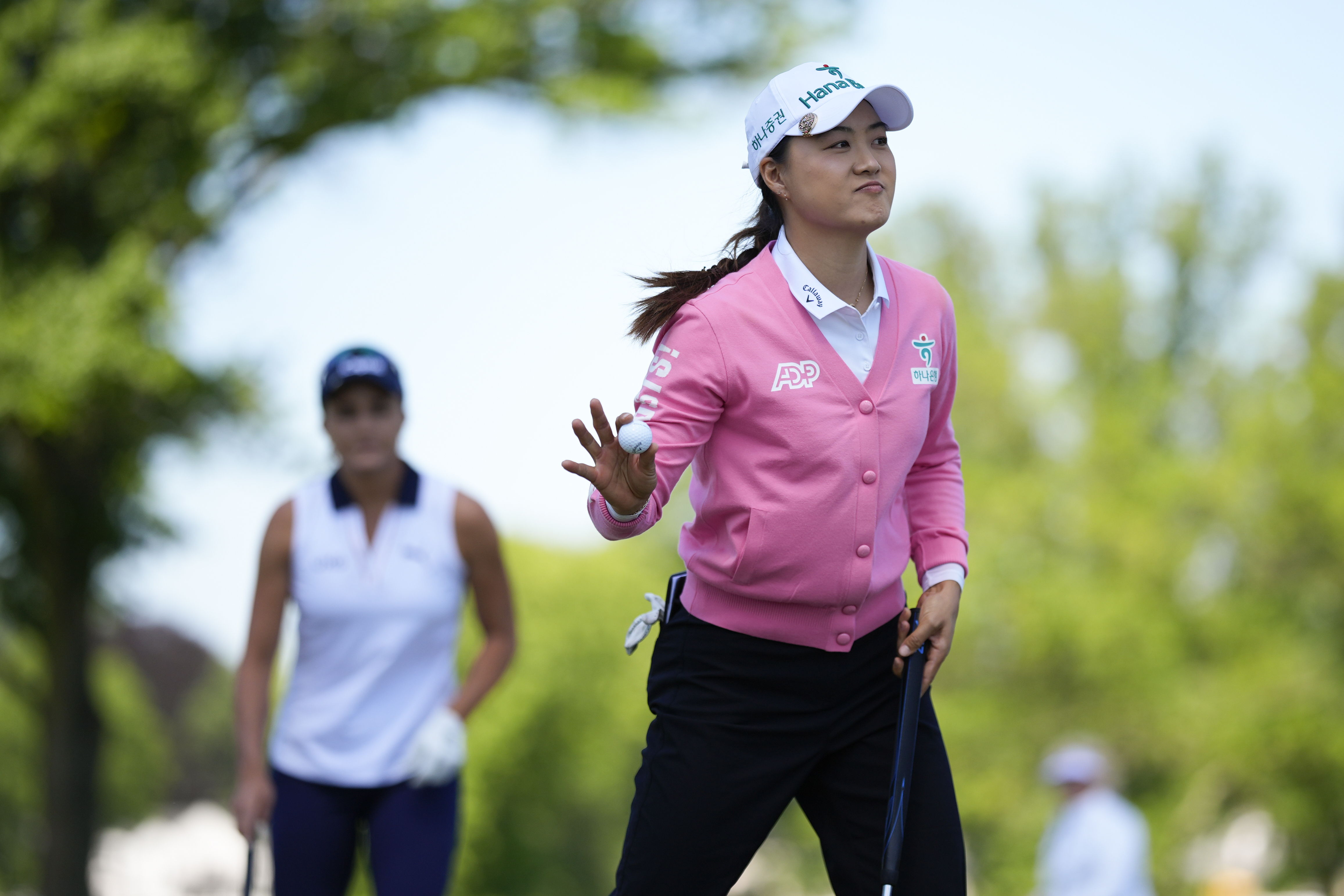 Minjee Lee, of Australia, waves to the gallery after making a putt on the first green during the second round of the U.S. Women's Open golf tournament at Lancaster Country Club, Friday, May 31, 2024, in Lancaster, Pa.