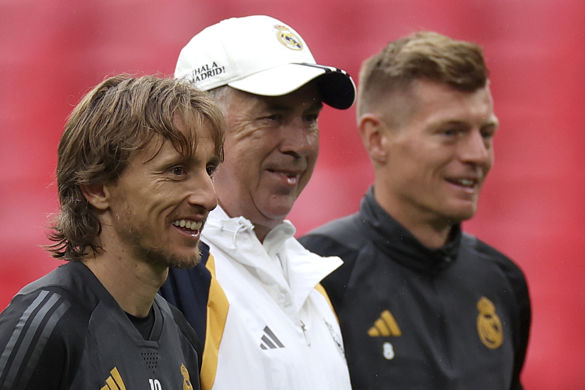 Real Madrid's Luka Modric, from left, Real Madrid's head coach Carlo Ancelotti and Real Madrid's Toni Kroos stand together during a training session ahead of the Champions League final soccer match between Borussia Dortmund and Real Madrid at Wembley Stadium in London, Friday, May 31, 2024.