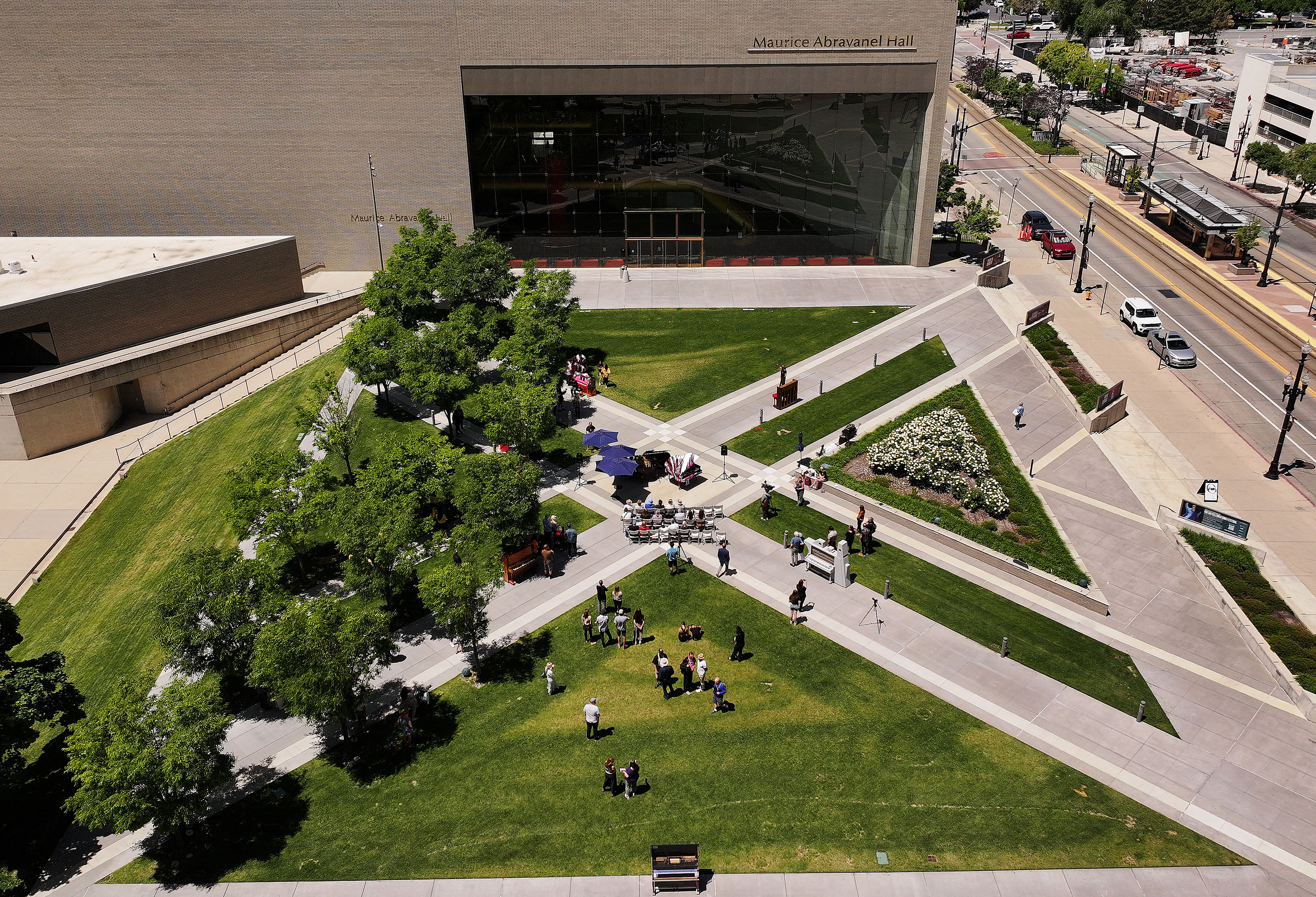 Artists unveil their public art installation of upcycled pianos at Abravanel Hall Plaza in Salt Lake City on Friday.