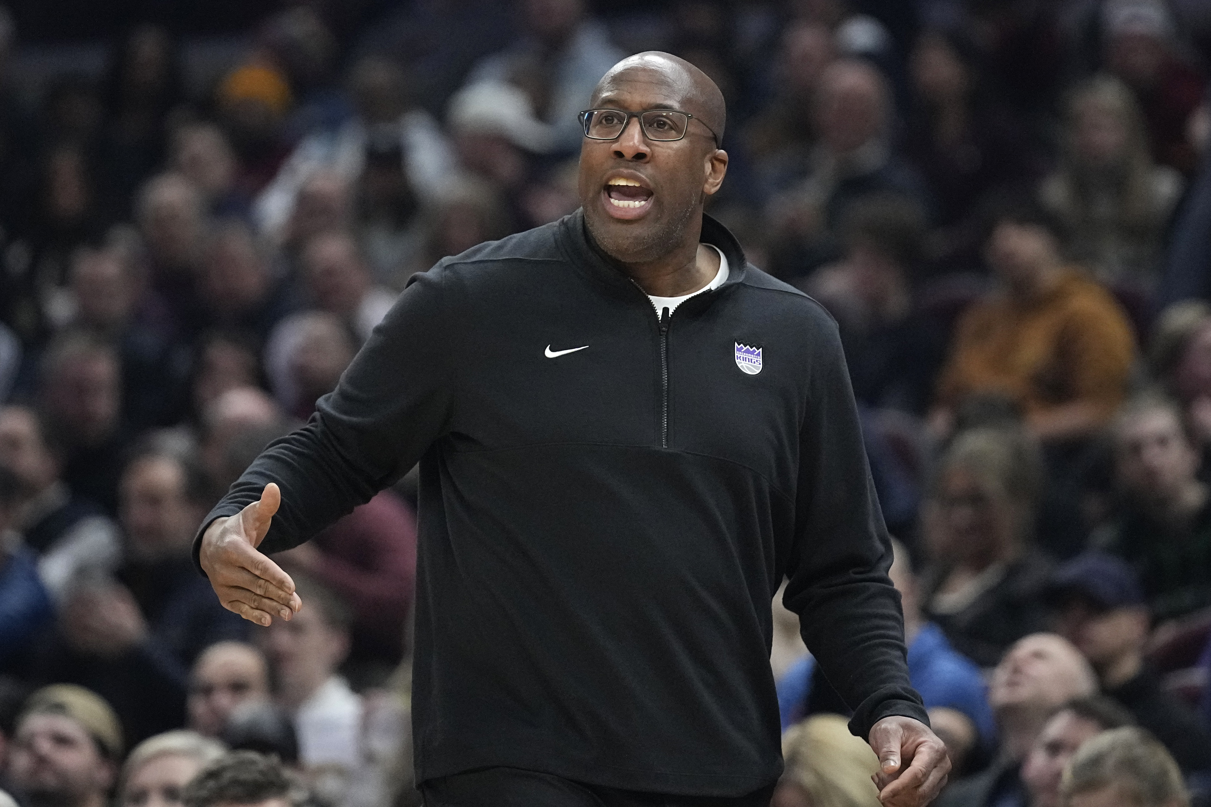 FILE - Sacramento Kings coach Mike Brown gestures during the first half of the team's NBA basketball game against the Cleveland Cavaliers, Feb. 5, 2024, in Cleveland. The Kings have agreed to a extension with Brown to keep him under contract through the 2026-27 season, a person familiar with the deal said Friday, May 31. 