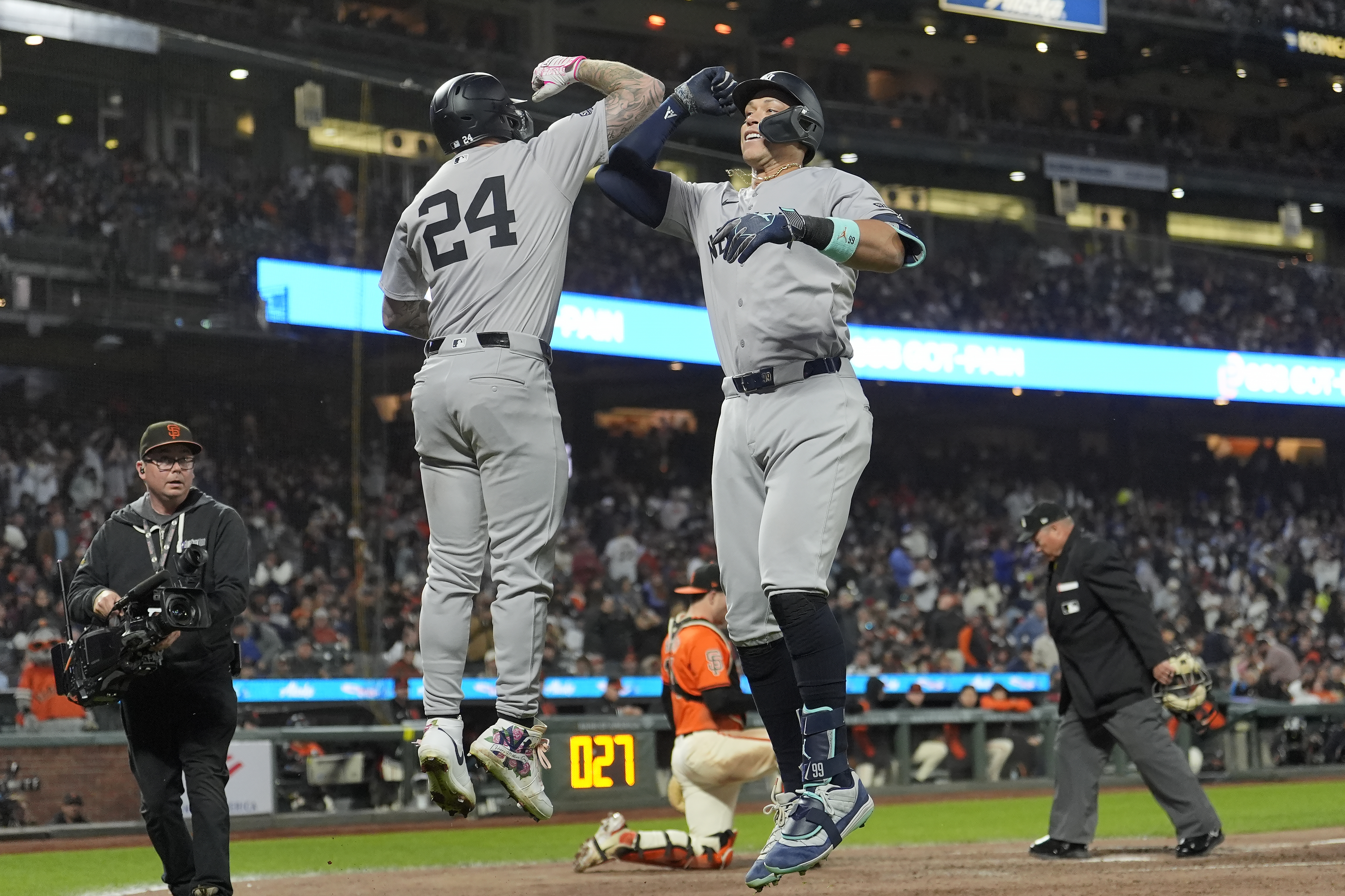 New York Yankees' Aaron Judge, front right, is congratulated by Alex Verdugo (24) for a home run against the San Francisco Giants during the sixth inning of a baseball game in San Francisco, Friday, May 31, 2024. 