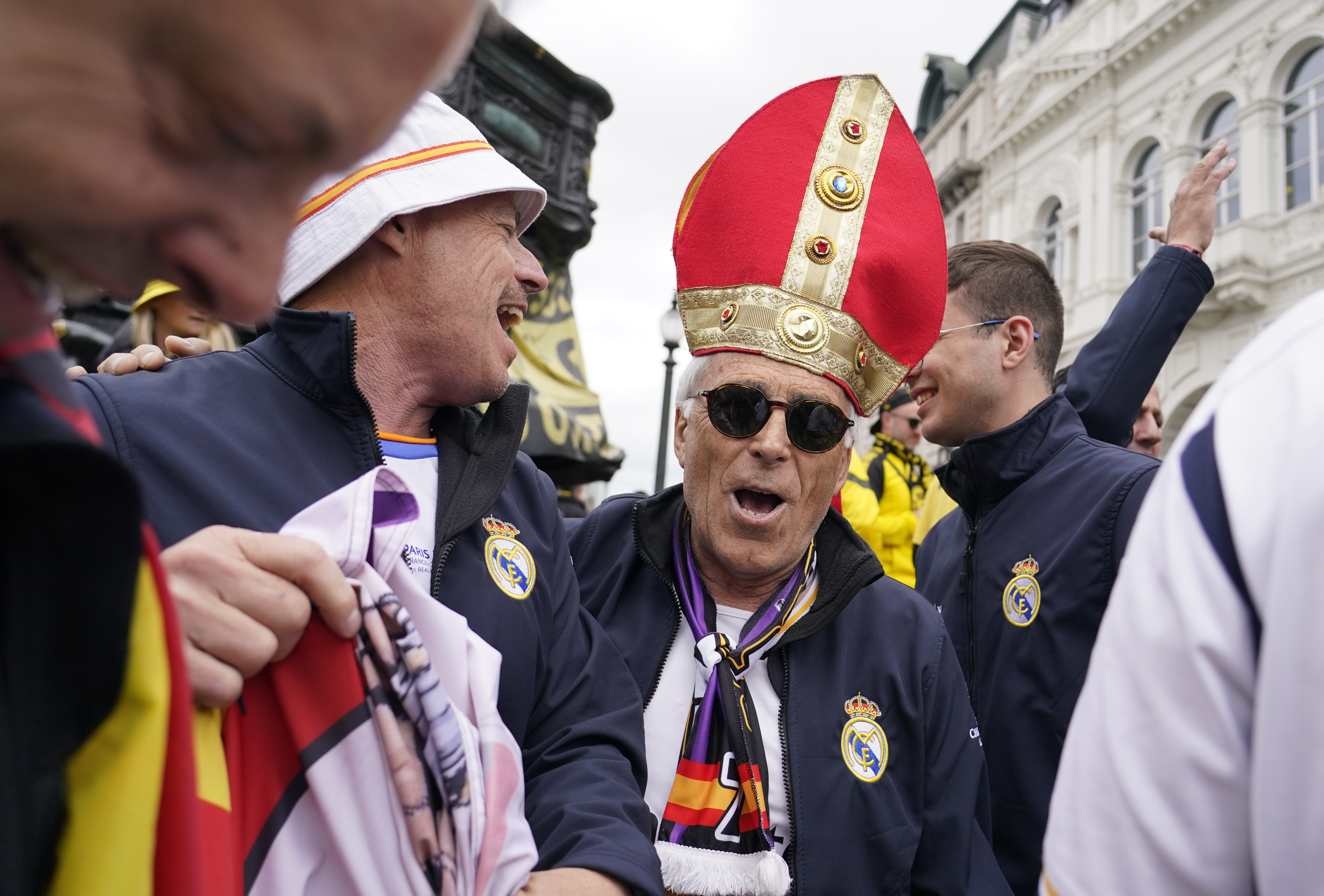 Real Madrid supporters react as they gather near Piccadilly Circus in central London ahead of the Champions League final soccer match between Borussia Dortmund and Real Madrid which will take place at Wembley stadium later, Saturday, June 1, 2024. 
