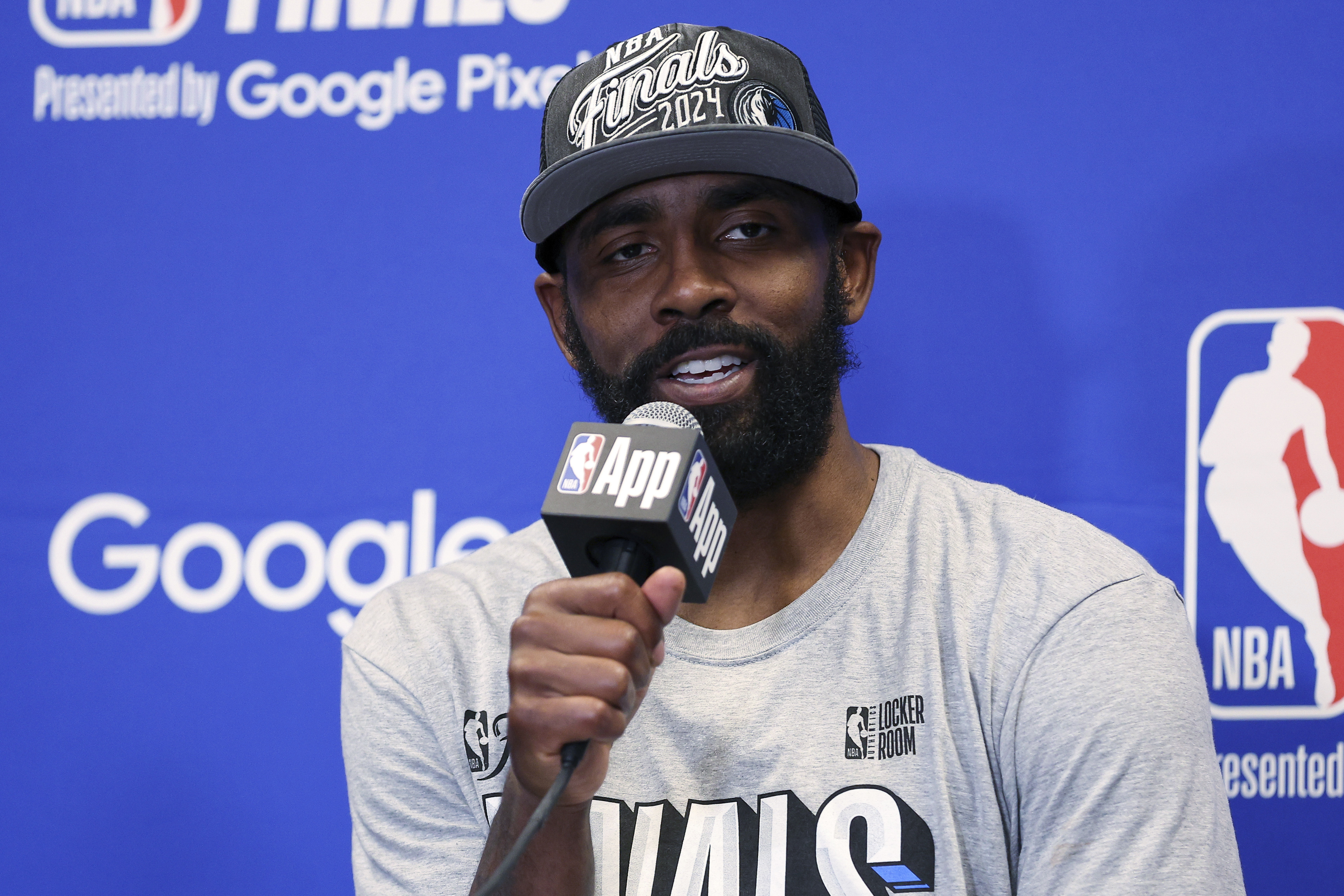 Dallas Mavericks guard Kyrie Irving answers questions during a news conference after the Mavericks defeated the Minnesota Timberwolves in Game 5 of the NBA basketball Western Conference finals, Thursday, May 30, 2024, in Minneapolis. 