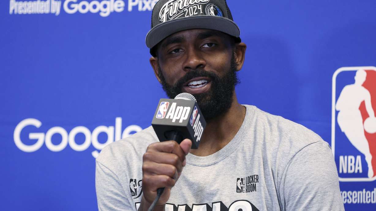 Dallas Mavericks guard Kyrie Irving answers questions during a news conference after the Mavericks defeated the Minnesota Timberwolves in Game 5 of the NBA basketball Western Conference finals, Thursday, May 30, 2024, in Minneapolis.