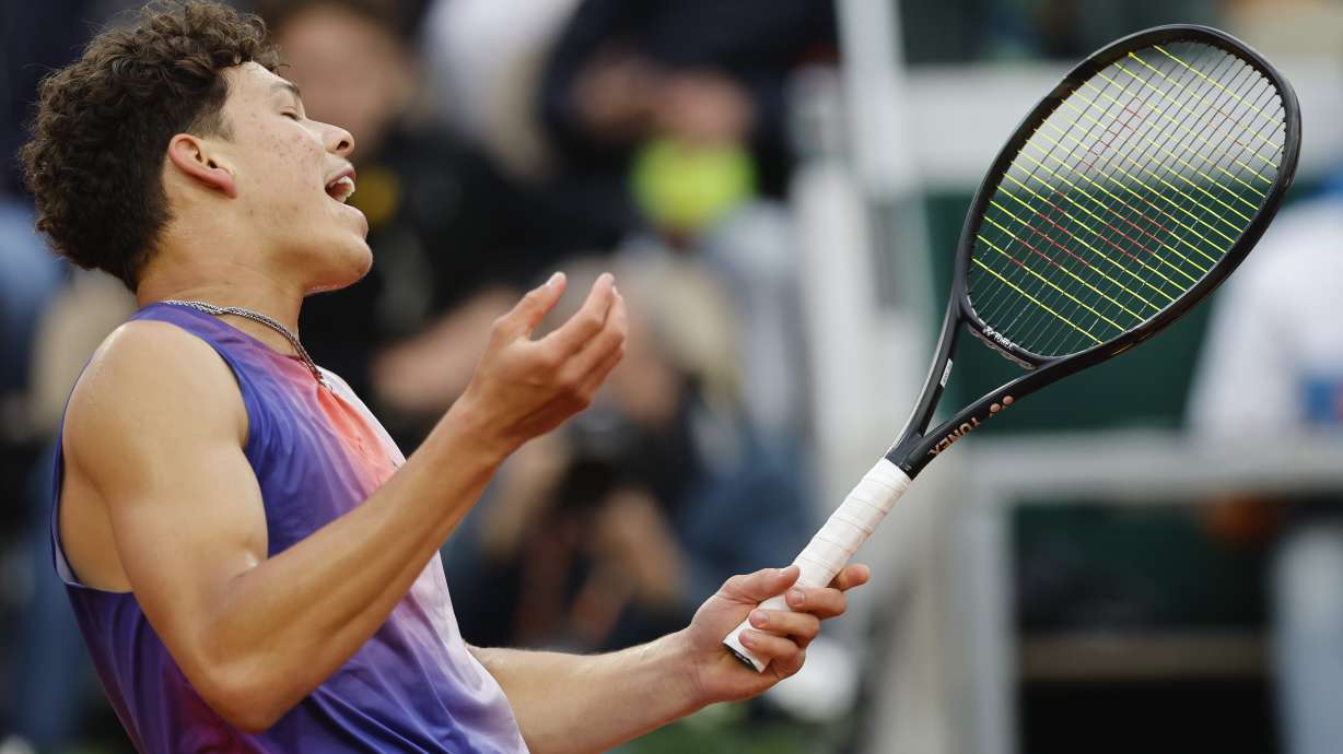Ben Shelton of the U.S. reacts after missing a shot against Canada's Felix Auger-Aliassime during their third round match of the French Open tennis tournament at the Roland Garros stadium in Paris, Saturday, June 1, 2024.