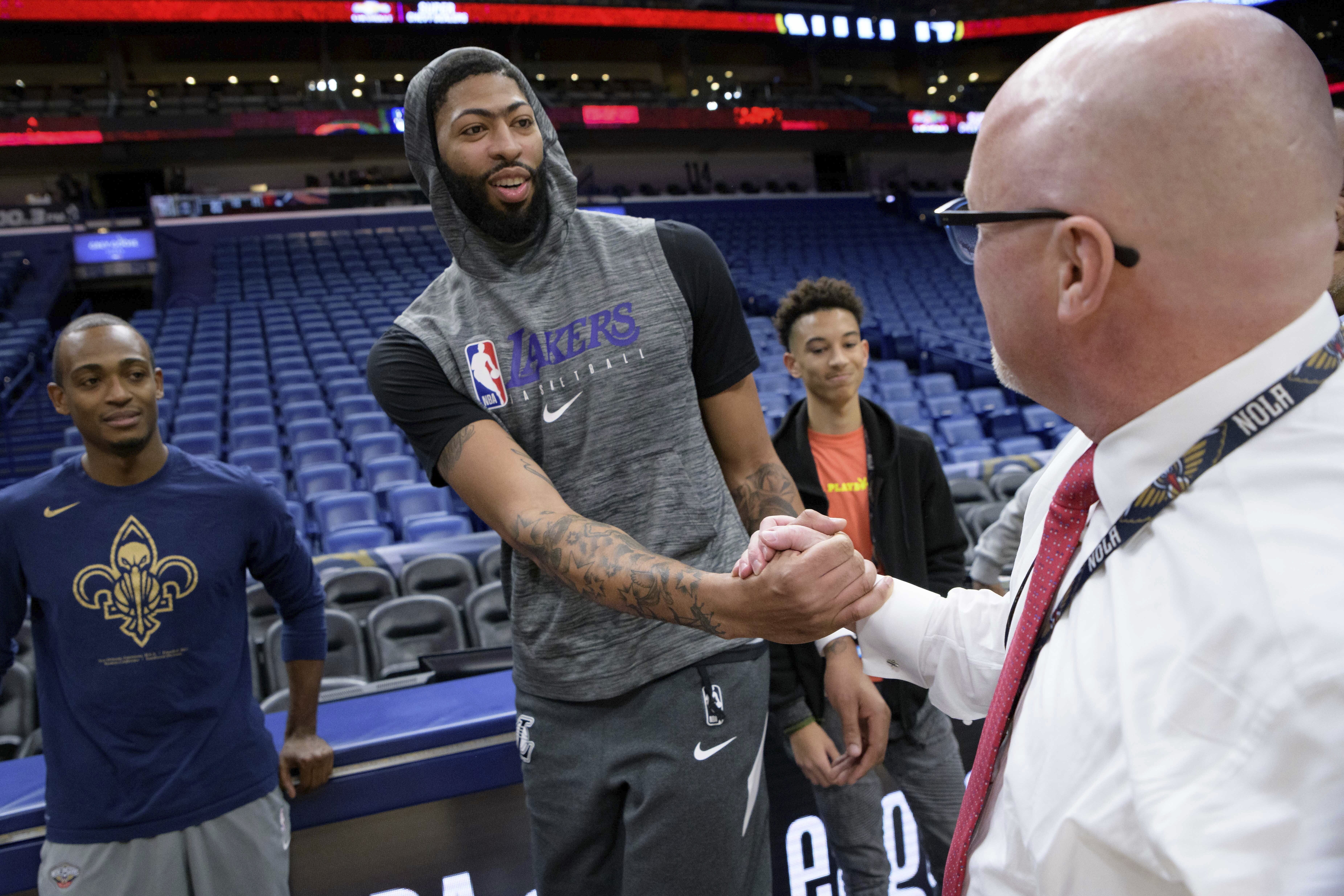 Los Angeles Lakers forward Anthony Davis greets New Orleans Pelicans Executive Vice President of Basketball Operations David Griffin before an NBA basketball game in New Orleans, Wednesday, Nov. 27, 2019. The Pelicans have opted to wait until 2025 to use the last of the three first-round draft choices they received from the Lakers as part of the 2019 Anthony Davis trade, a person familiar with the decision told The Associated Press, Saturday, June 1, 2024. 