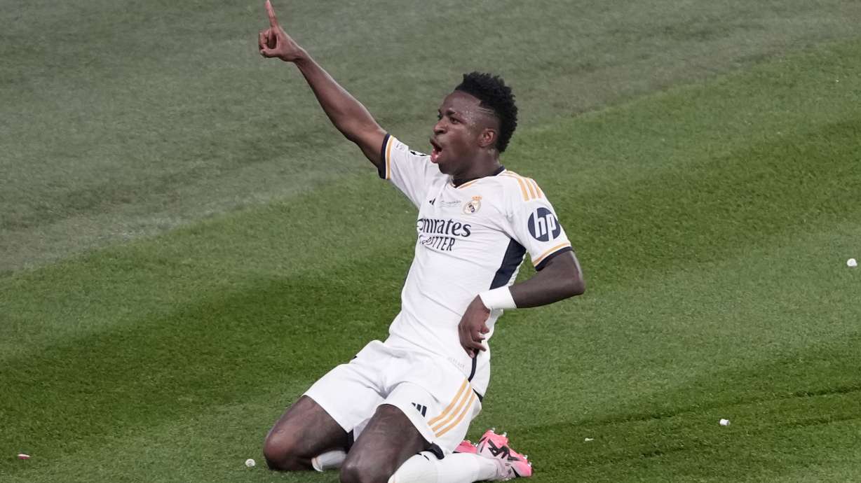 Real Madrid's Vinicius Junior celebrates after scoring his side's second goal during the Champions League final soccer match between Borussia Dortmund and Real Madrid at Wembley stadium in London, Saturday, June 1, 2024.