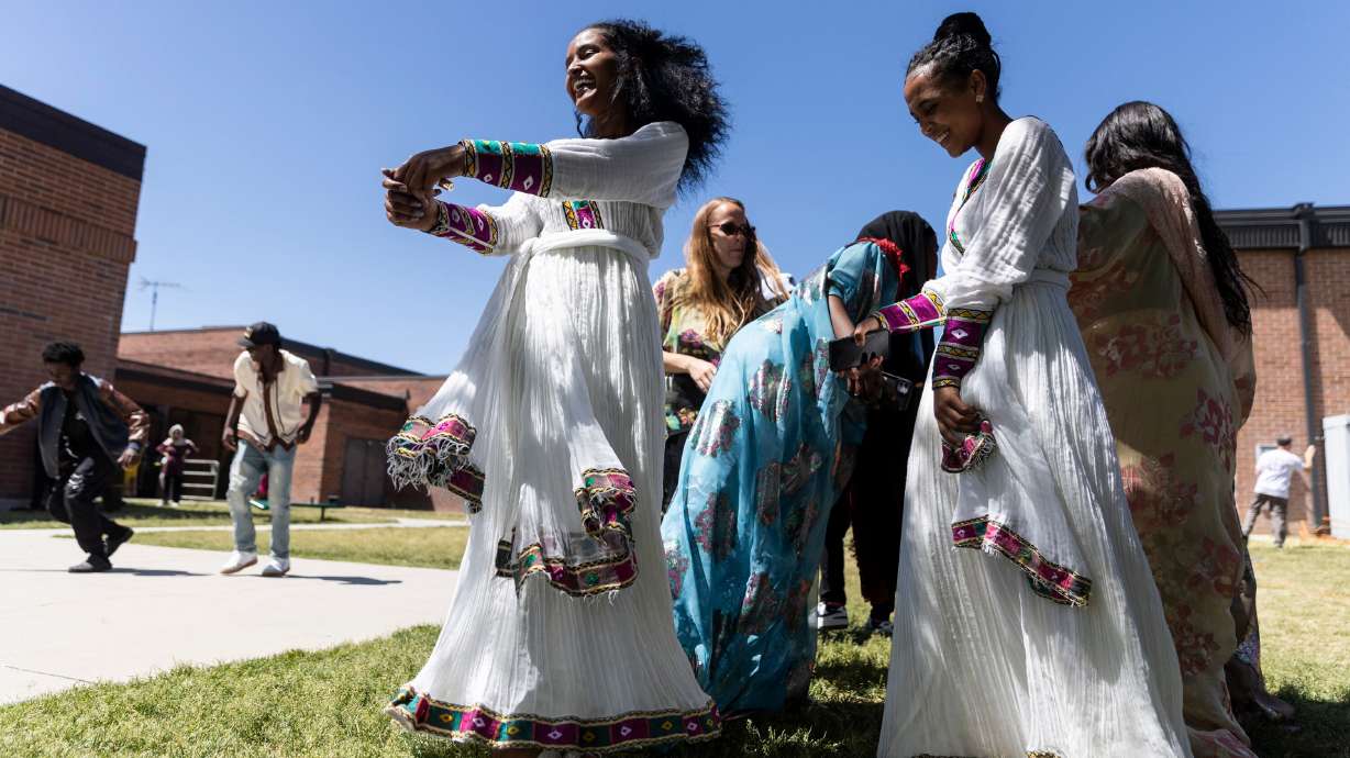 Students dance during a reunion to celebrate 10 years of the Utah International Charter School in Salt Lake City, on Friday. The school is open to all Utah students but its student body is largely comprised of refugees and other new Americans.