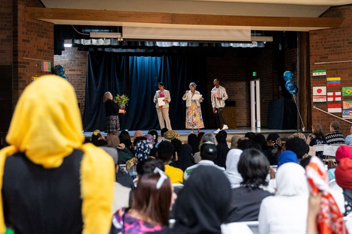 Principal Usha Narra is honored during a reunion to celebrate 10 years of the Utah International Charter School in Salt Lake City, on Friday. The school is open to all Utah students but its student body is largely comprised of refugees and other new Americans.