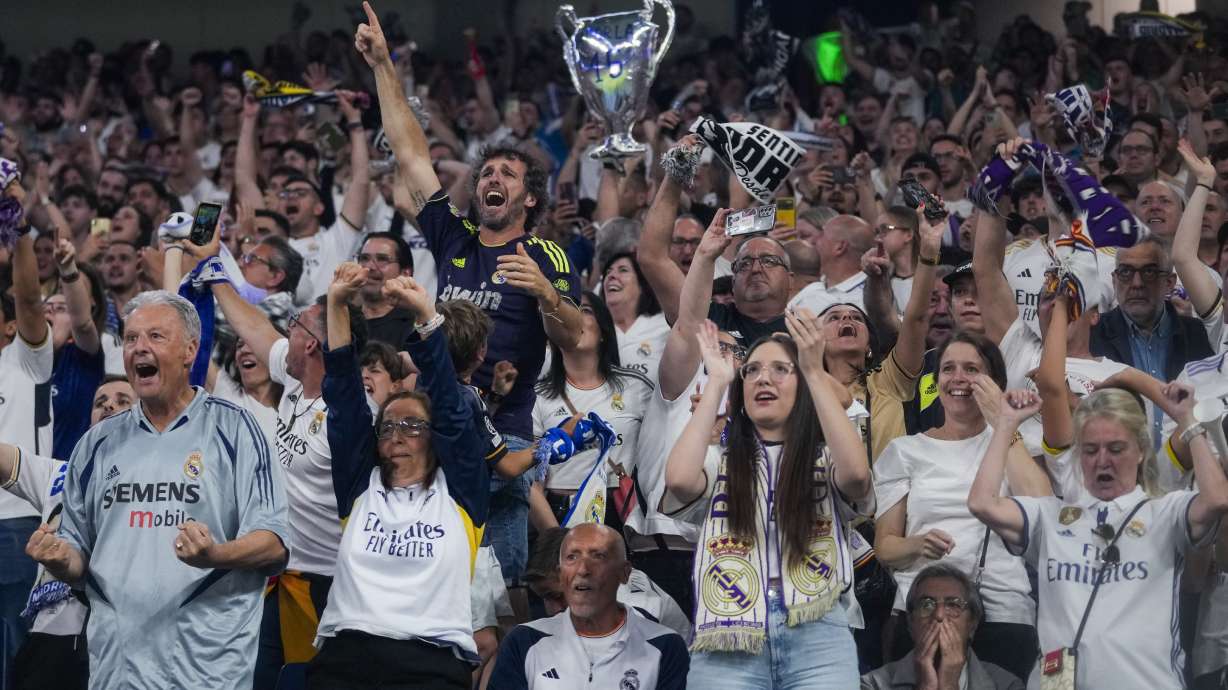 Real Madrid fans celebrate their team goal as they wat the Champions League final soccer match between Real Madrid and Borussia Dortmund at Santiago Bernabeu stadium, in Madrid, Spain, Saturday, June 1, 2024.