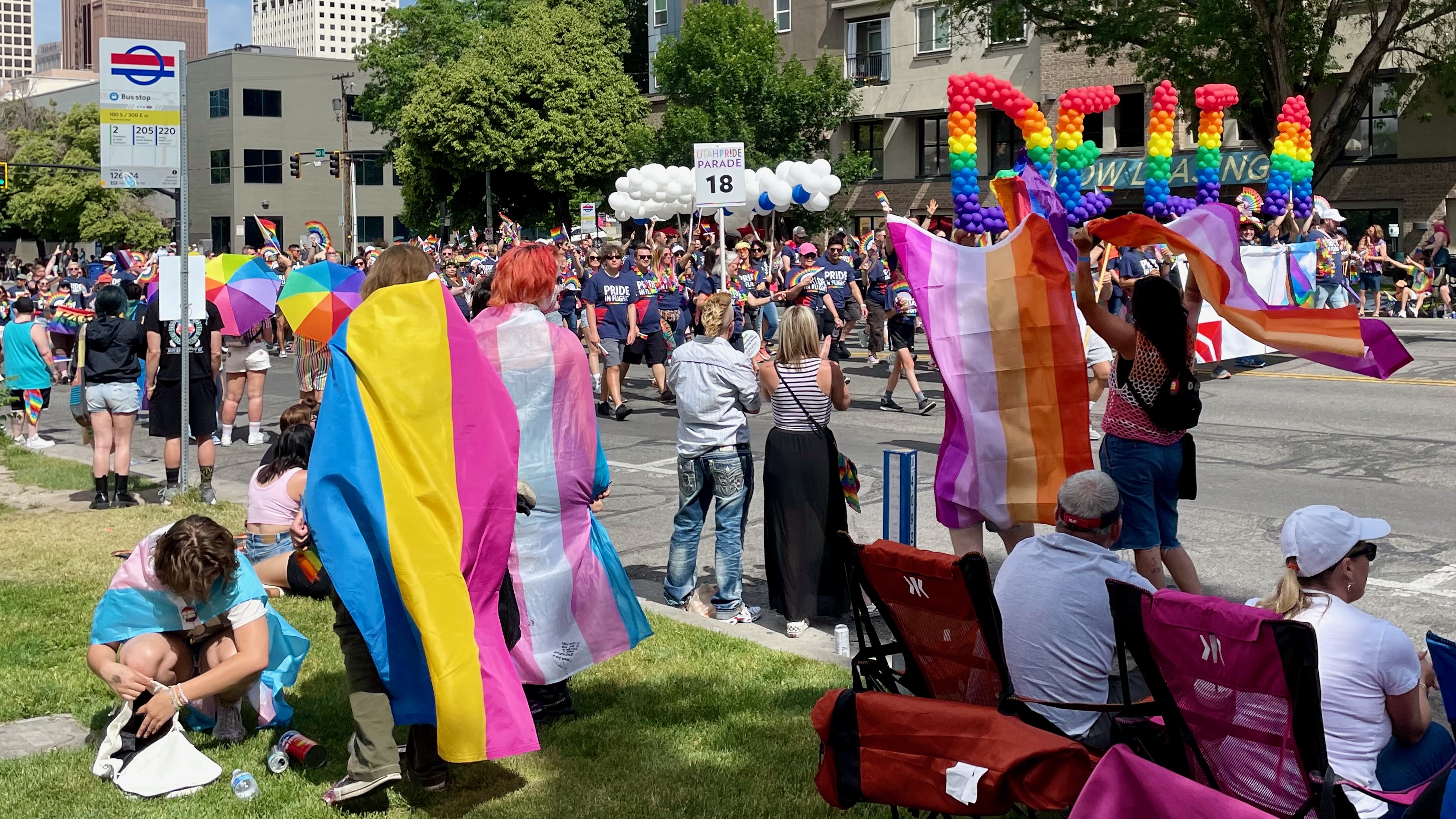 Spectators watch as marchers in the Utah Pride Parade in Salt Lake City on Sunday pass by.