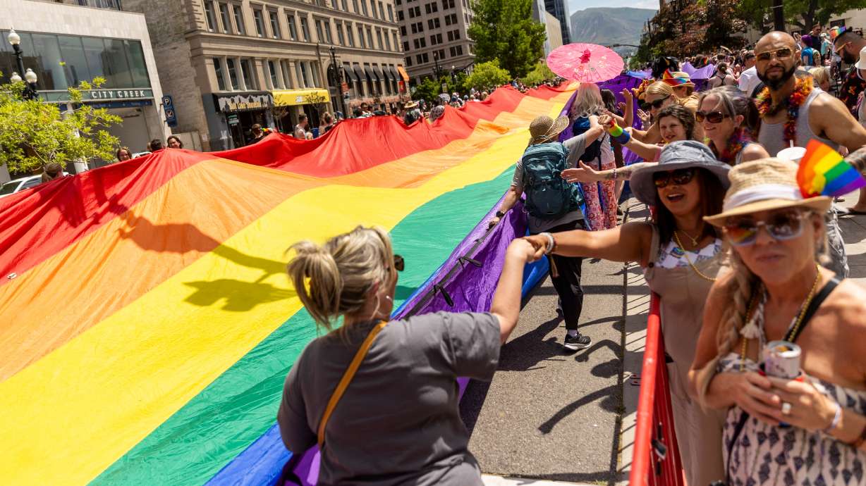 Utahns gather to celebrate Pride Month during the Pride Parade as it passes through Downtown in Salt Lake City on Sunday.