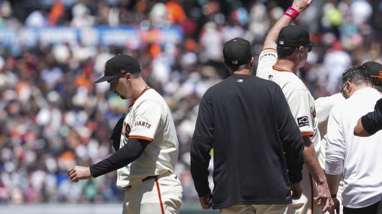 San Francisco Giants manager Bob Melvin, third from left, signals of the bullpen as pitcher Blake Snell, left, exits during the fifth inning of a baseball game against the New York Yankees, Sunday, June 2, 2024, in San Francisco.