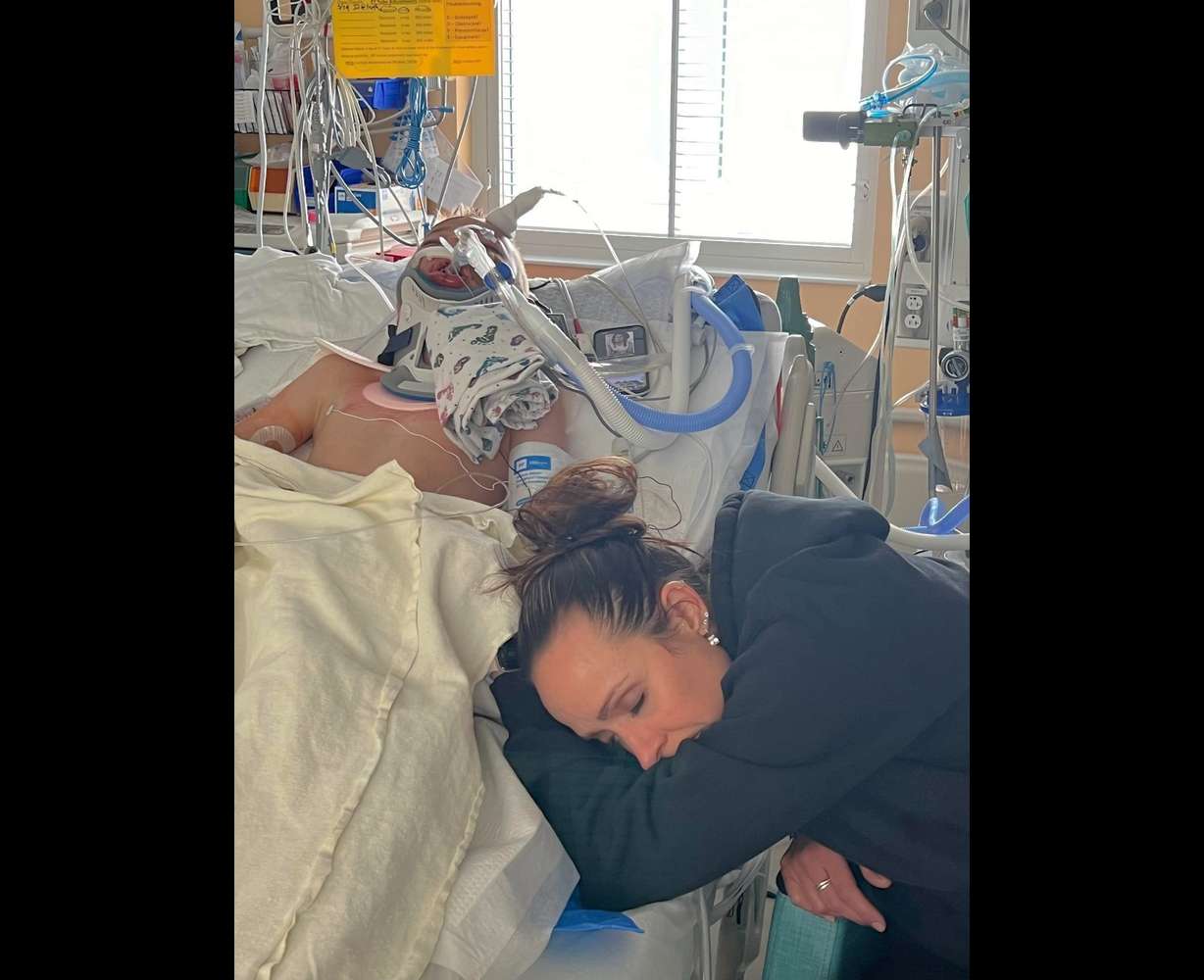 Tiffany Vendela at the bedside of her son Trayden at Primary Children's Hospital in Salt Lake City. The community is hoping for the 9-year-old boy's recovery after he was hit by a car while riding his bike in Huntsville on Wednesday.