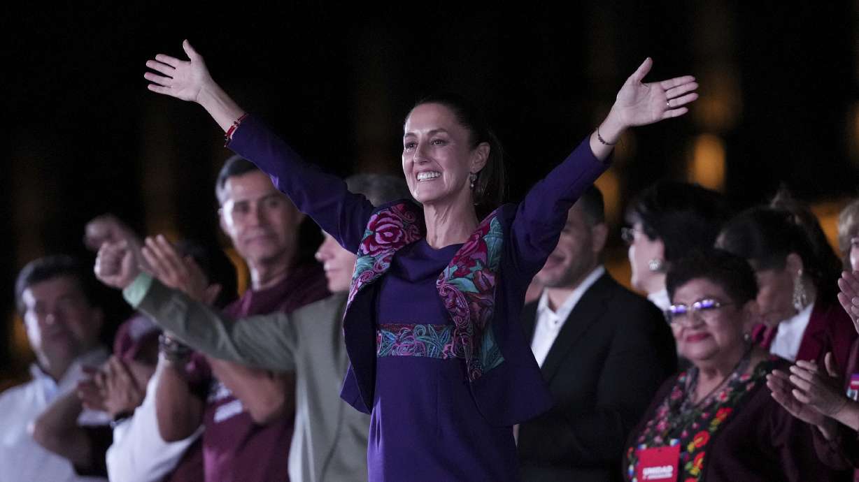 President-elect Claudia Sheinbaum waves to supporters at the Zocalo, Mexico City's main square, after the National Electoral Institute announced she held an irreversible lead in the election, early Monday.
