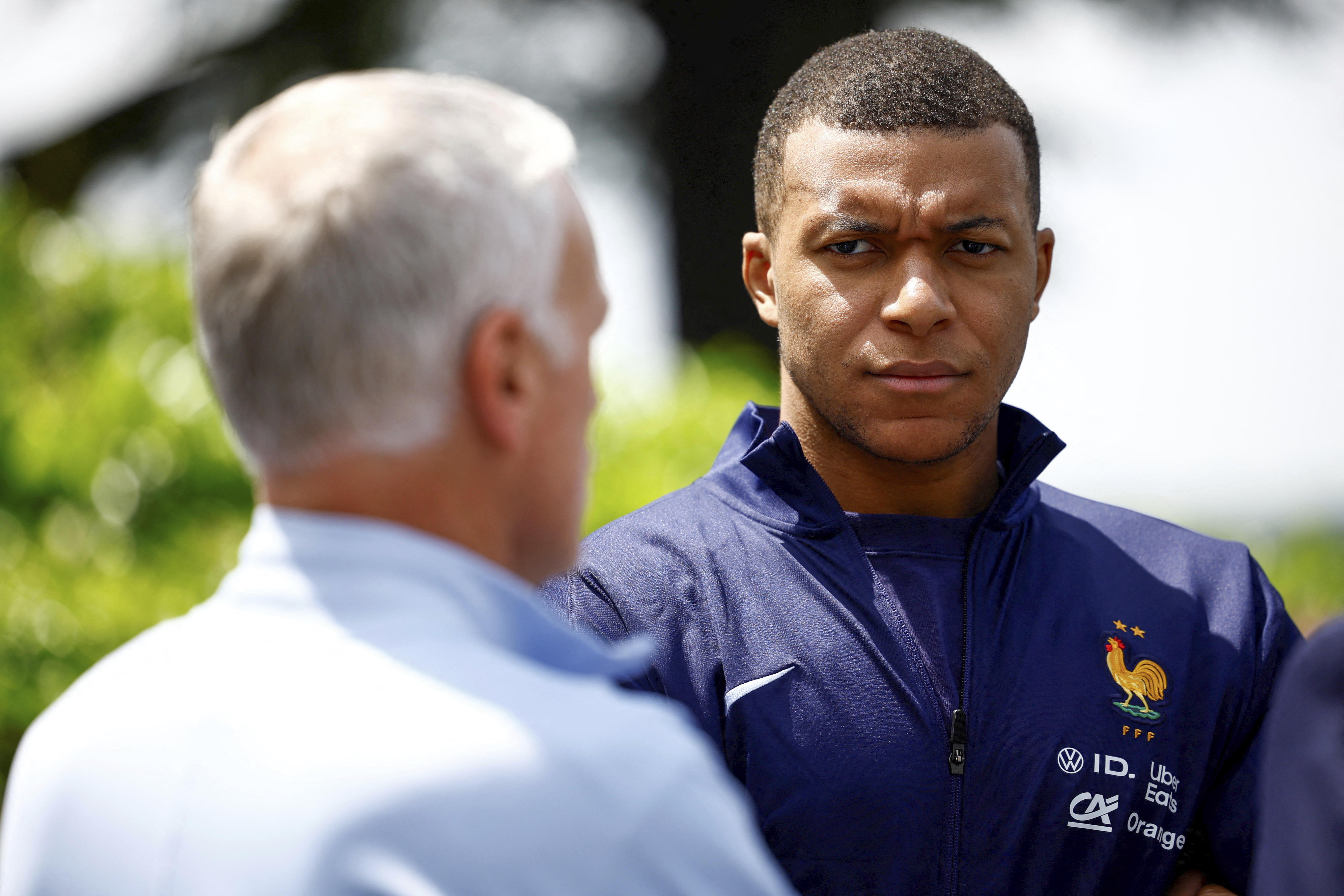 French soccer player Kylian Mbappe, right, listening to head coach Didier Deschamps at the national soccer team training center in Clairefontaine, west of Paris, Monday, June 3, 2024 ahead of the UEFA Euro 2024. 