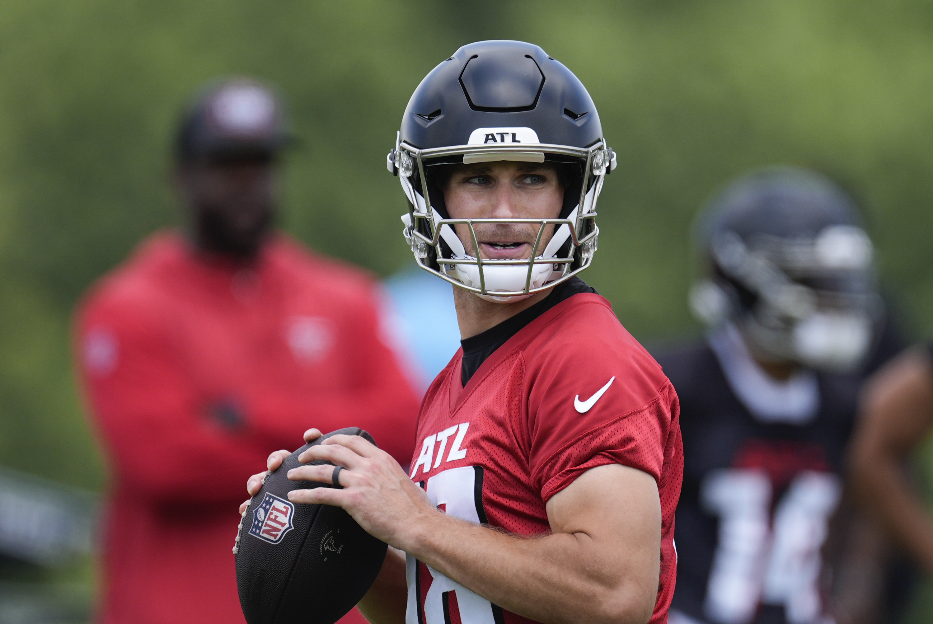 Atlanta Falcons quarterback Kirk Cousins throws a pass during an NFL football practice Monday, June 3, 2024, in Flowery Branch, Ga. 