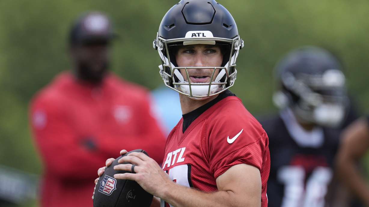 Atlanta Falcons quarterback Kirk Cousins throws a pass during an NFL football practice Monday, June 3, 2024, in Flowery Branch, Ga.