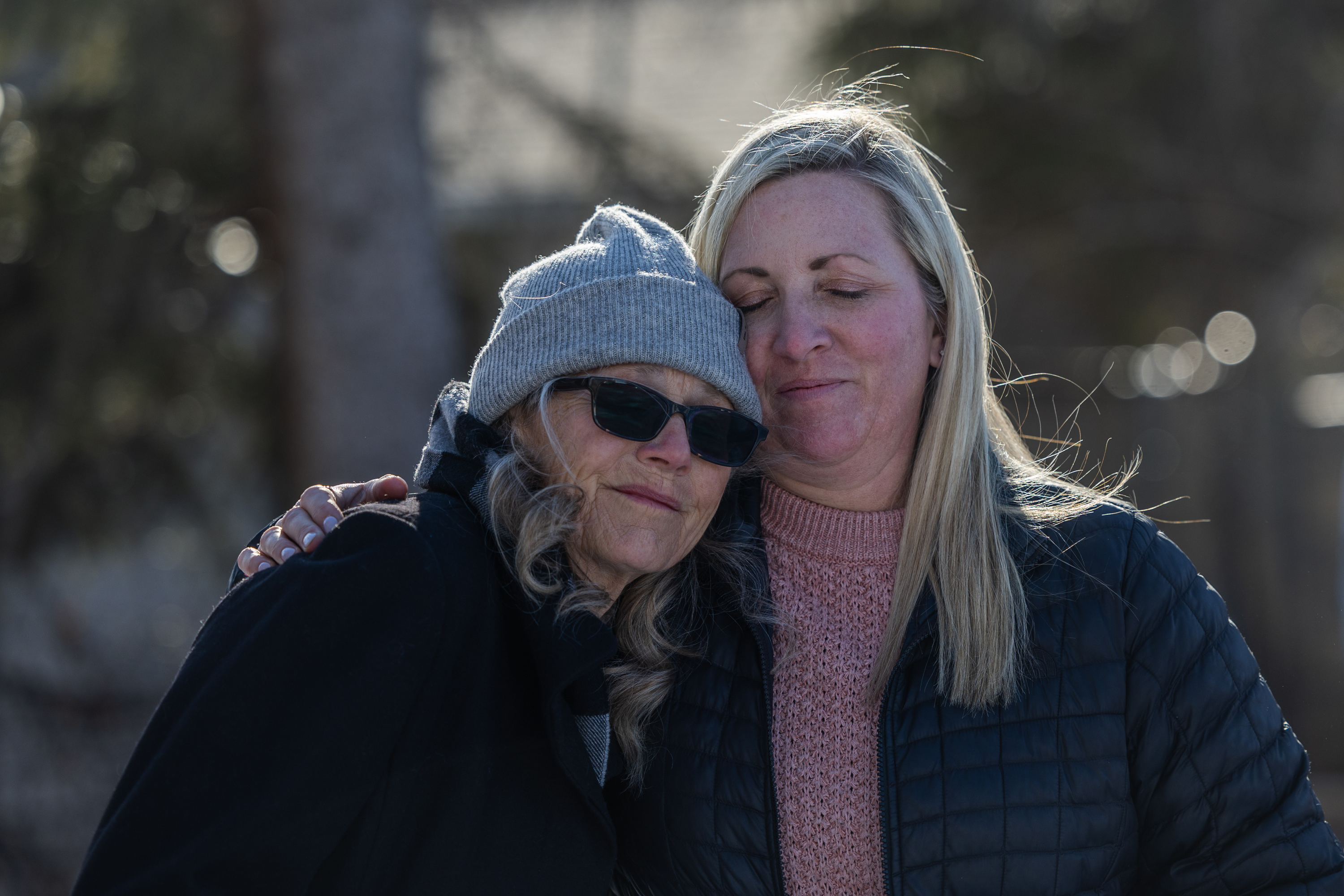 Ann Marie Herpich, left, sister to Jordan Rasmussen, hugs Lisa Rasmussen Opfar, Jordan’s daughter, at Wasatch Lawn Memorial Park and Mortuary in Millcreek on March 5, 2023.