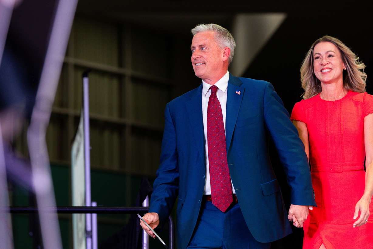 Jason J. Walton, who is running for U.S. Senate, walks out with his wife, Kristen Peterson Walton, at the Utah Republican Party state nominating convention at the Salt Palace Convention Center in Salt Lake City on April 27.