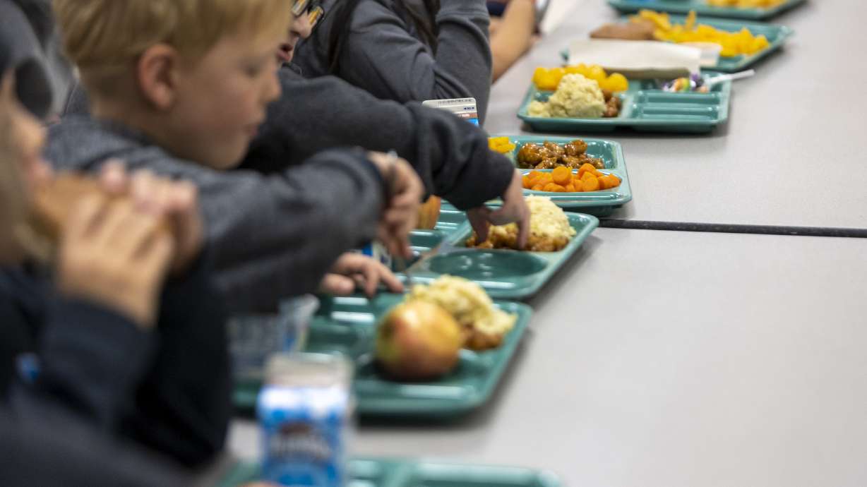 Students eat lunch at Westvale Elementary School in West Jordan on Nov. 7, 2022. School districts across the Beehive State are doing what they can to provide meals for students throughout the summer.