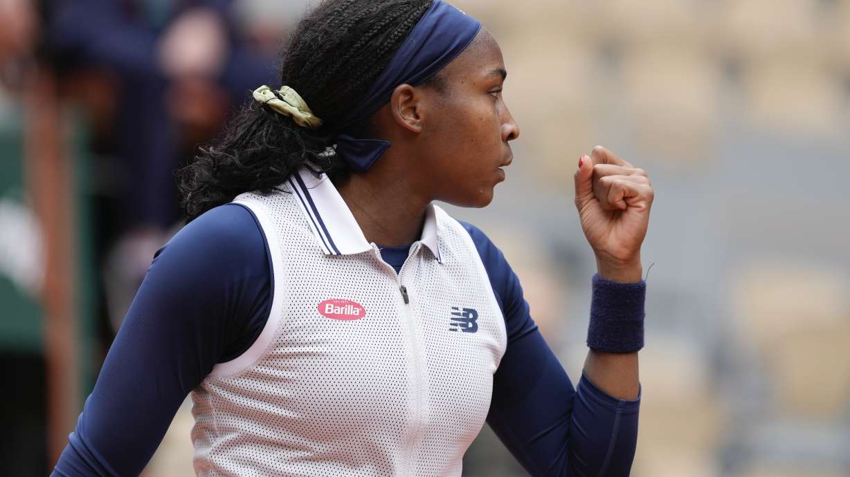 Coco Gauff of the U.S. clenches her fist after scoring a point against Italy's Elisabetta Cocciaretto during their fourth round match of the French Open tennis tournament at the Roland Garros stadium in Paris, Sunday, June 2, 2024.