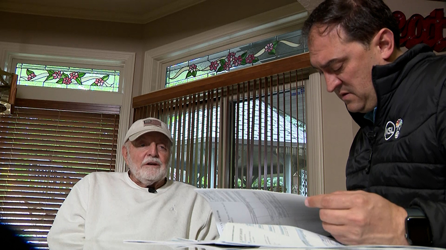 Bruce Hart and KSL’s Matt Gephardt pour through 30 years of Hart’s property tax assessments to verify the same charge had appeared as a line item every year.