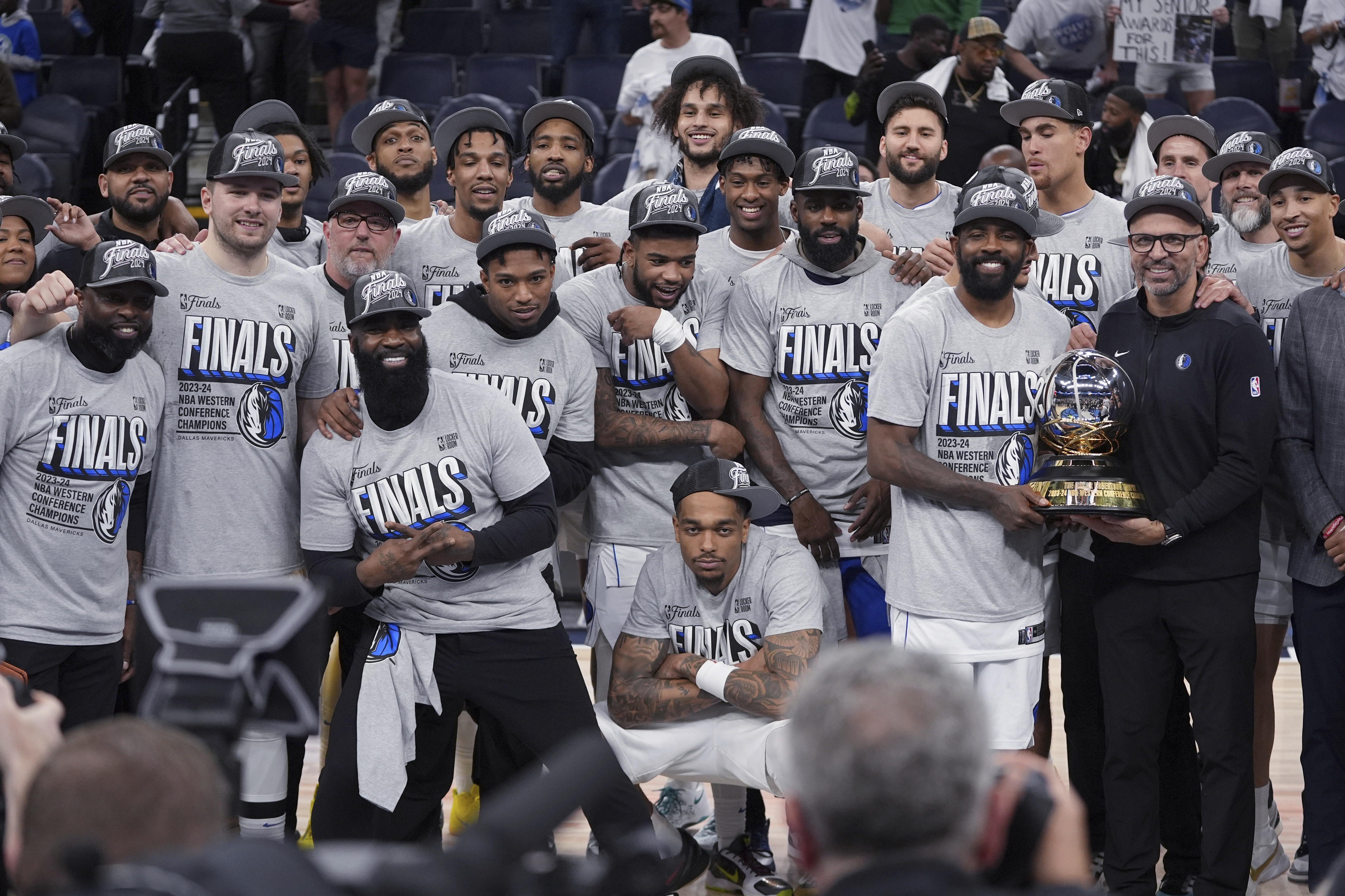 The Dallas Mavericks pose for a team photograph after a win over the Minnesota Timberwolves in Game 5 of the Western Conference finals in the NBA basketball playoffs Thursday, May 30, 2024, in Minneapolis. The Mavericks won 124-103, taking the series 4-1 and moving on to the NBA Finals. 