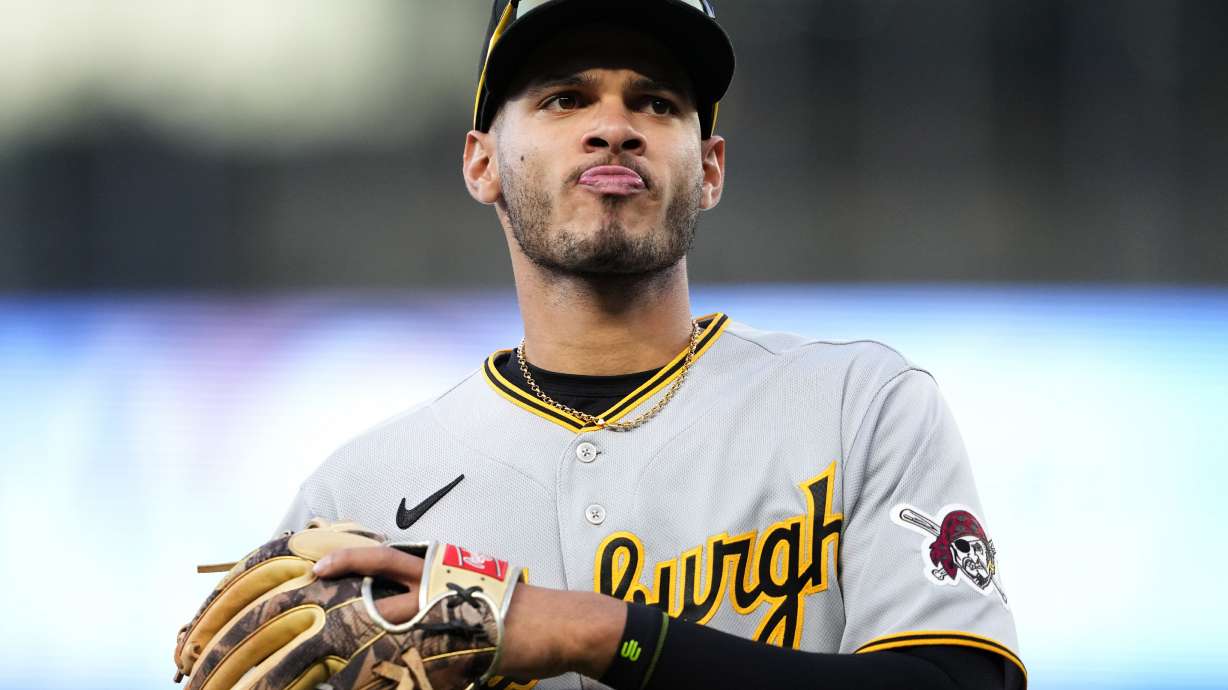 FILE - Pittsburgh Pirates' Tucupita Marcano jogs off the field against the Seattle Mariners in a baseball game, Friday, May 26, 2023, in Seattle. Major League Baseball has permanently banned Marcano Tuesday, June 4, 2024, for betting on baseball and suspended the four other players for one year after finding the players placed unrelated bets with a legal sportsbook.