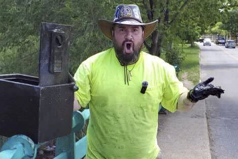 In this still image from video, magnet fisher James Kane reacts to the contents of a safe he pulled out of a pond, in Flushing Meadows Corona Park, in the Queens borough of New York, May 31.