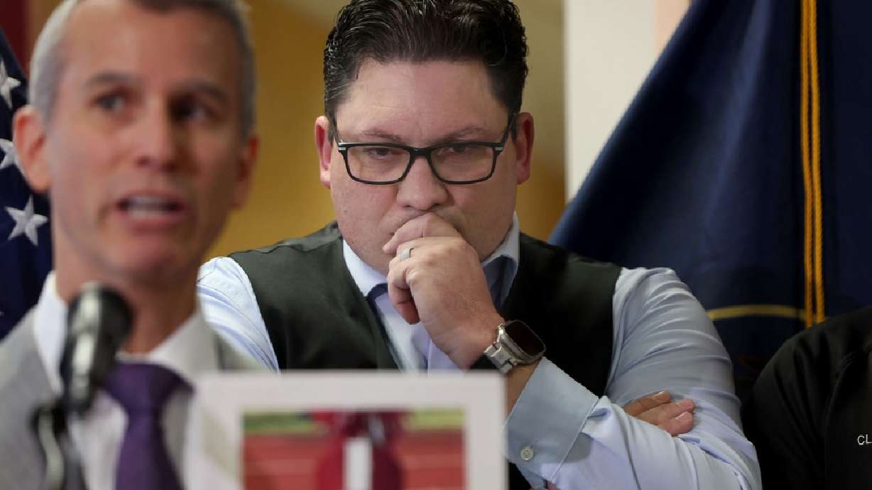Rep. Ryan D. Wilcox, right, listens as Max Schachter, father of a Parkland shooting victim, speaks at the signing of a school safety bill in Salt Lake City, April 10. The Utah School Board of Education is looking to establish a school safety dashboard. The school board received input from Schachter this week.