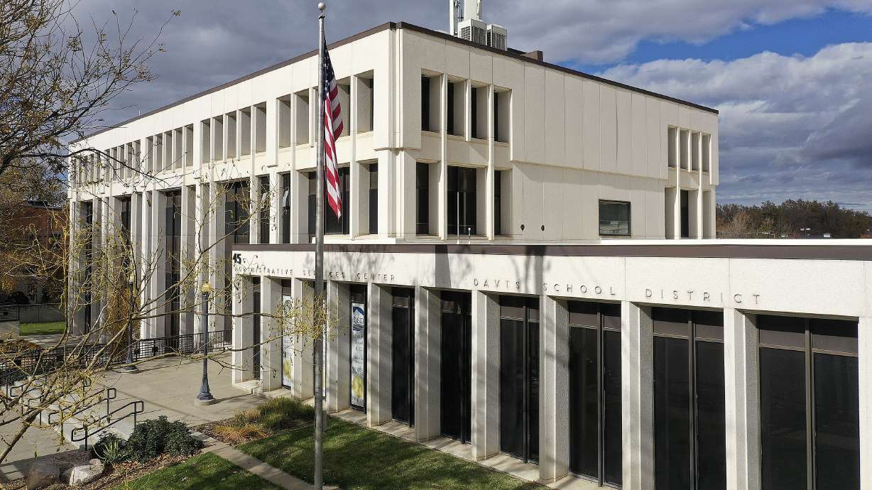 Davis School District officials and the former employee tasked with investigating racial harassment cases have agreed to dismiss a lawsuit she filed against the district.