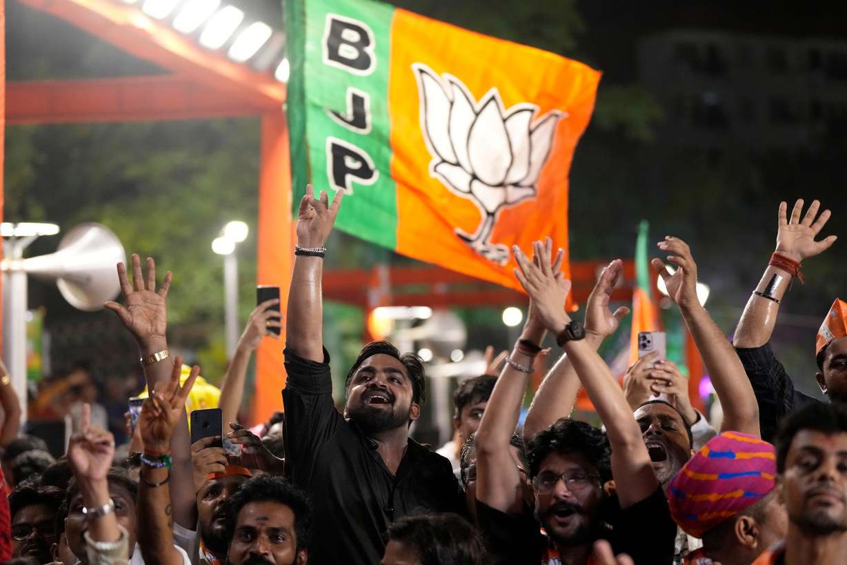 Bharatiya Janata Party (BJP) supporters shout slogans as they listen to Prime Minister Narendra Modi at the party headquarters in New Delhi, India, Tuesday.
