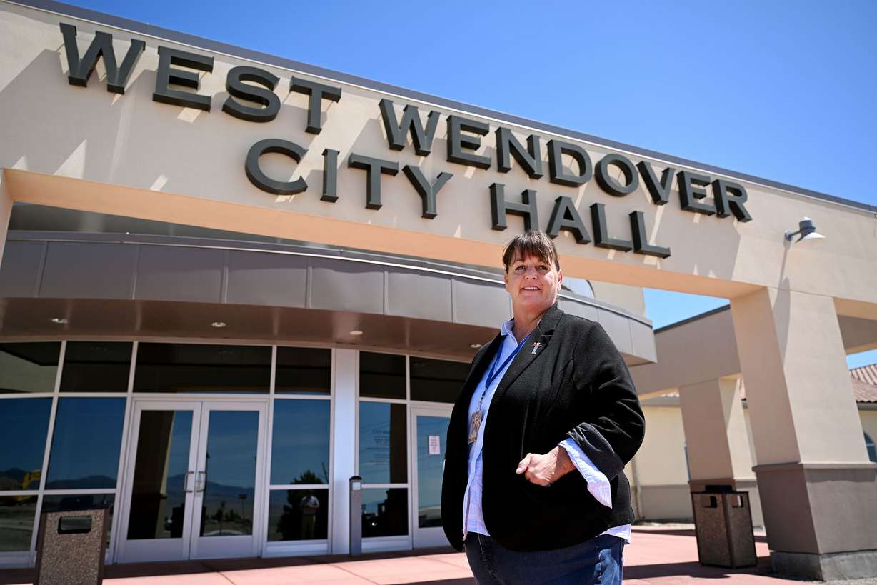 West Wendover, Nevada, Mayor Jasie Holm poses for a photo at the city offices on May 31. The community of Wendover is split in two. On the Nevada side, voters could help decide the next U.S. president. Across the street, in Utah, voters almost certainly won't.