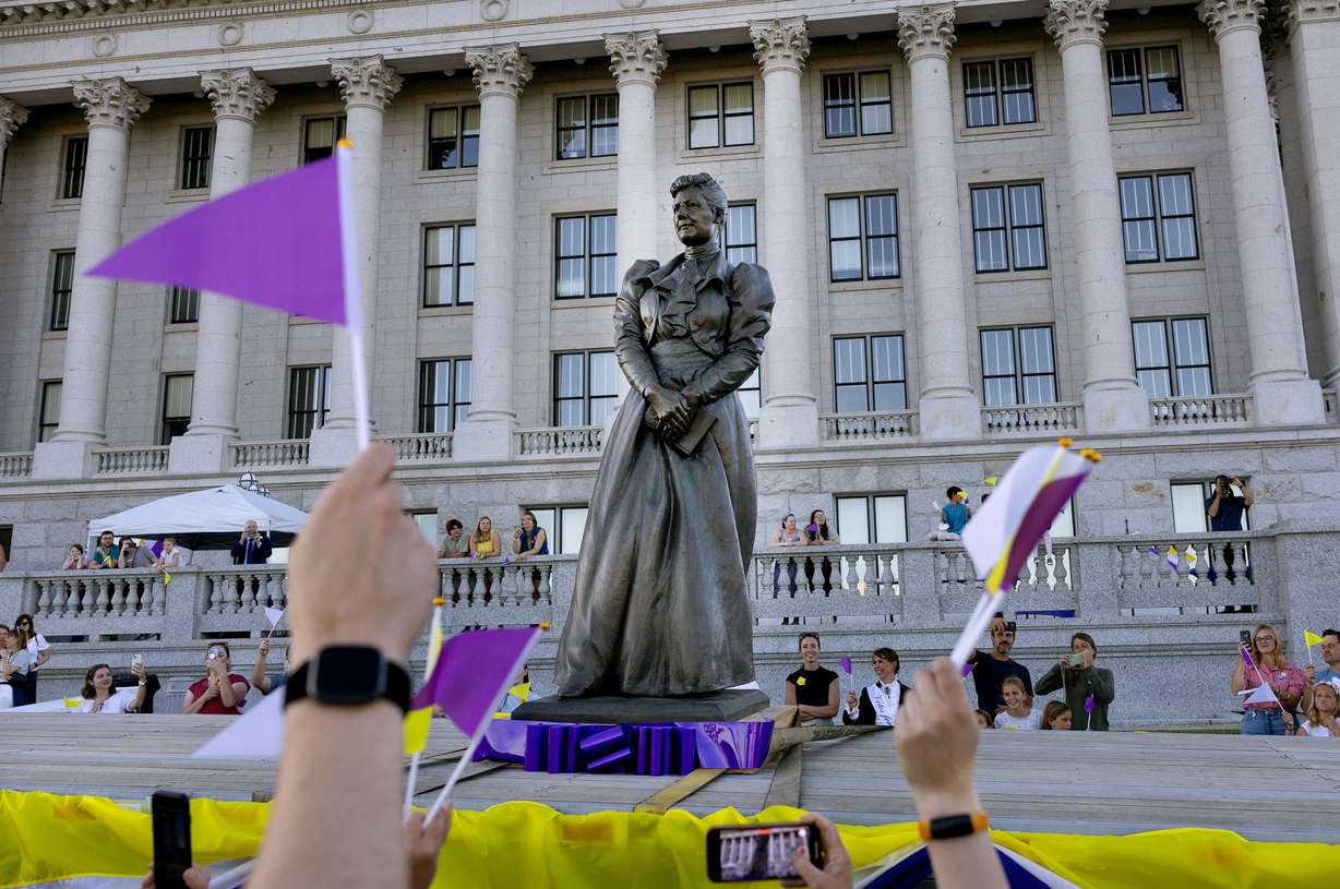 People wave goodbye to Utah’s statue of Martha Hughes Cannon as it heads to the U.S. Capitol at the state Capitol in Salt Lake City on June 5.