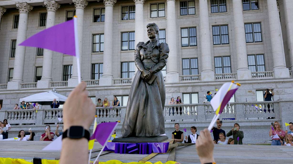 People wave goodbye to Utah’s statue of Martha Hughes Cannon as it heads to the U.S. Capitol at the Capitol in Salt Lake City on Wednesday.