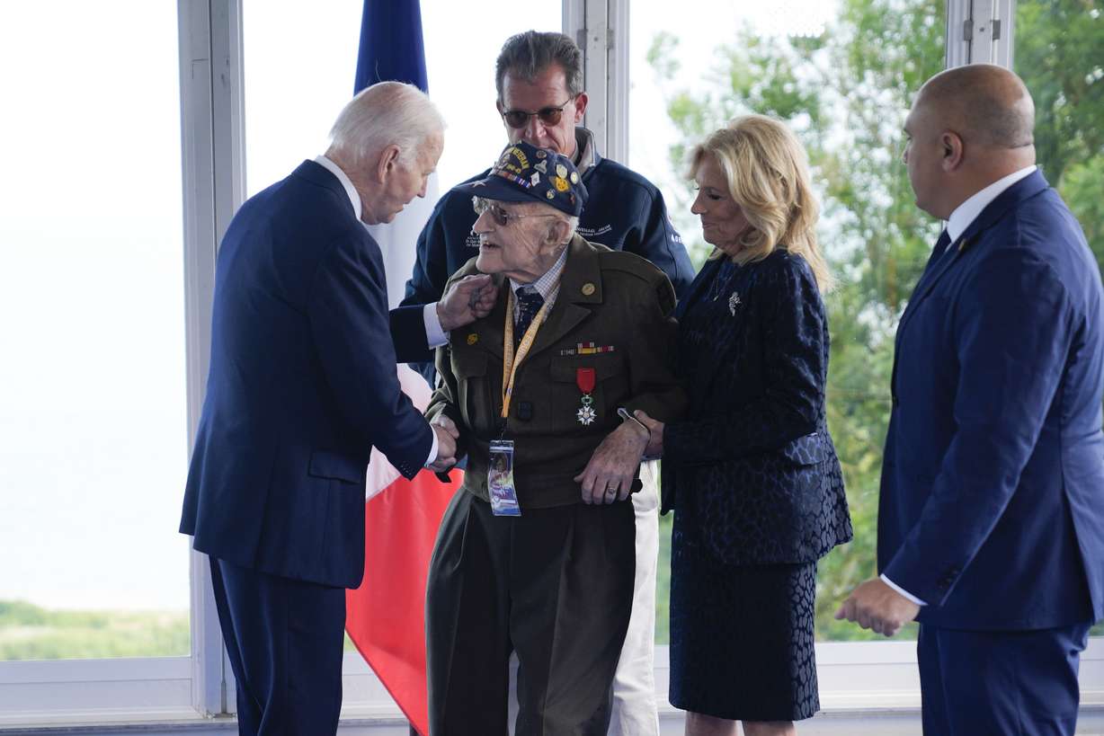 President Joe Biden and first lady Jill Biden, greet a World War II veteran during ceremonies to mark the 80th anniversary of D-Day, Thursday, in Normandy.