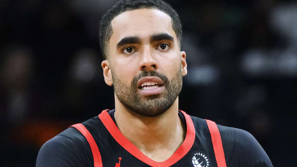 FILE - Toronto Raptors forward Jontay Porter is shown during the first half of the team's NBA basketball game against the Chicago Bulls, Jan. 18, 2024, in Toronto. Two more people, Timothy McCormack and Mahmud Mollah, have been charged in the sports betting scandal that prompted the NBA to ban former Toronto Raptors player Porter for life.