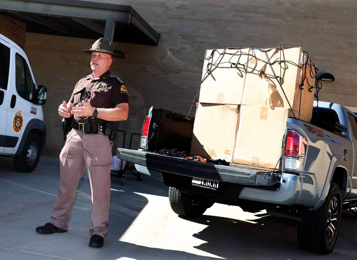 Utah Highway Patrol Lt. Cameron Roden speaks about the importance of properly securing transported objects with straps and nets on Thursday, which is National Secure Your Load Day.