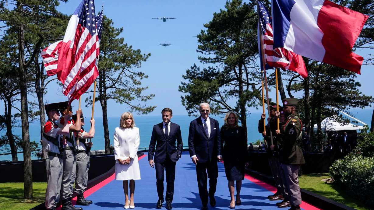 President Joe Biden, first lady Jill Biden, French President Emmanuel Macron and his wife Brigitte Macron attend a ceremony to mark the 80th anniversary of D-Day at the Normandy American Cemetery and Memorial in Colleville-sur-Mer, France, Thursday.