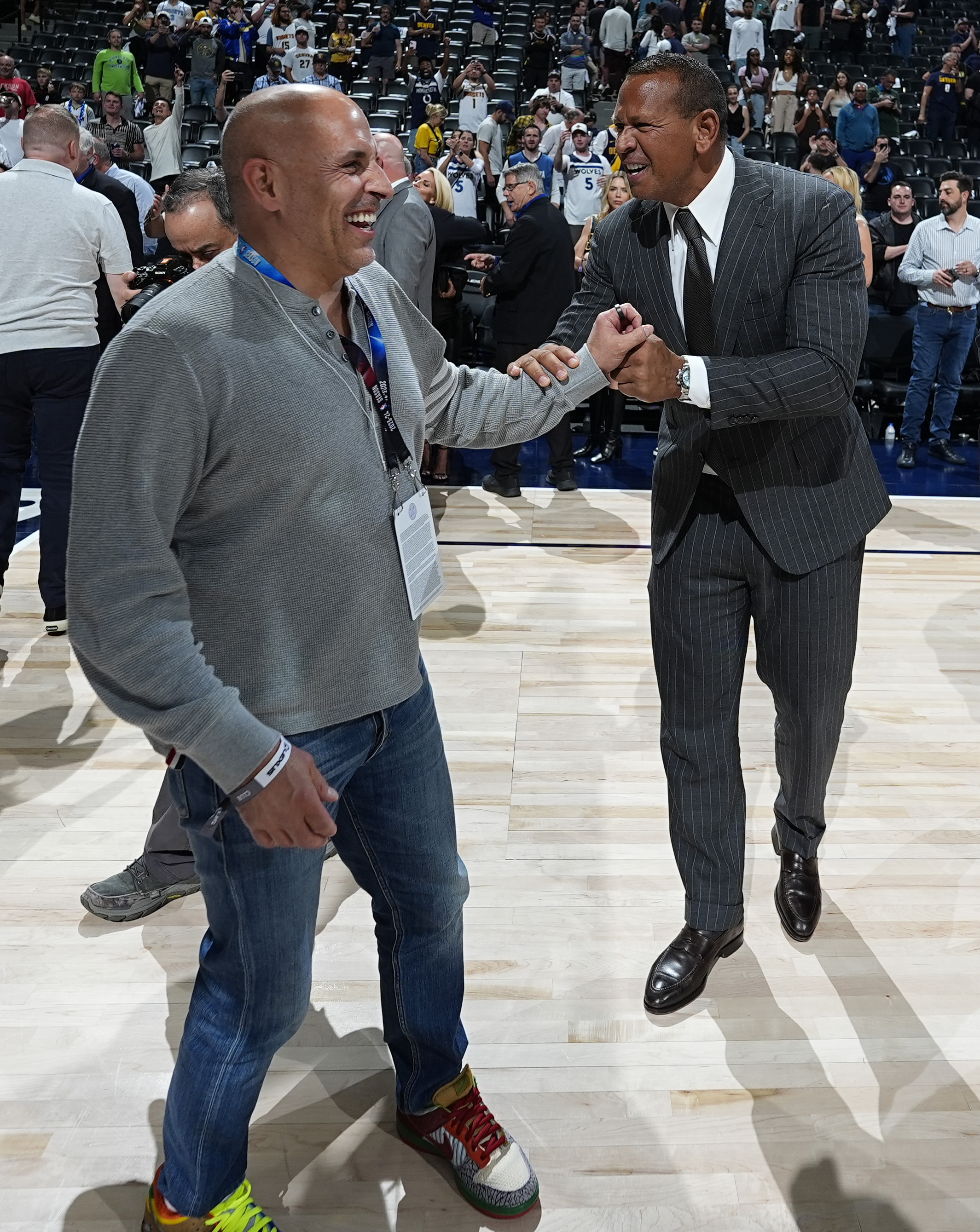 Minnesota Timberwolves minority owners Marc Lore, left, and Alex Rodriguez celebrate after Game 7 of an NBA second-round playoff series against the Denver Nuggets, Sunday, May 19, 2024, in Denver. 