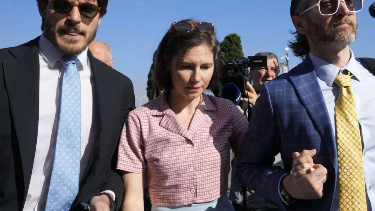 Amanda Knox arrives at the Florence courtroom in Florence, Italy, Wednesday. Knox told Italian TV on Thursday she will appeal her conviction of slander for accusing a Congolese bar owner of murdering her British housemate.